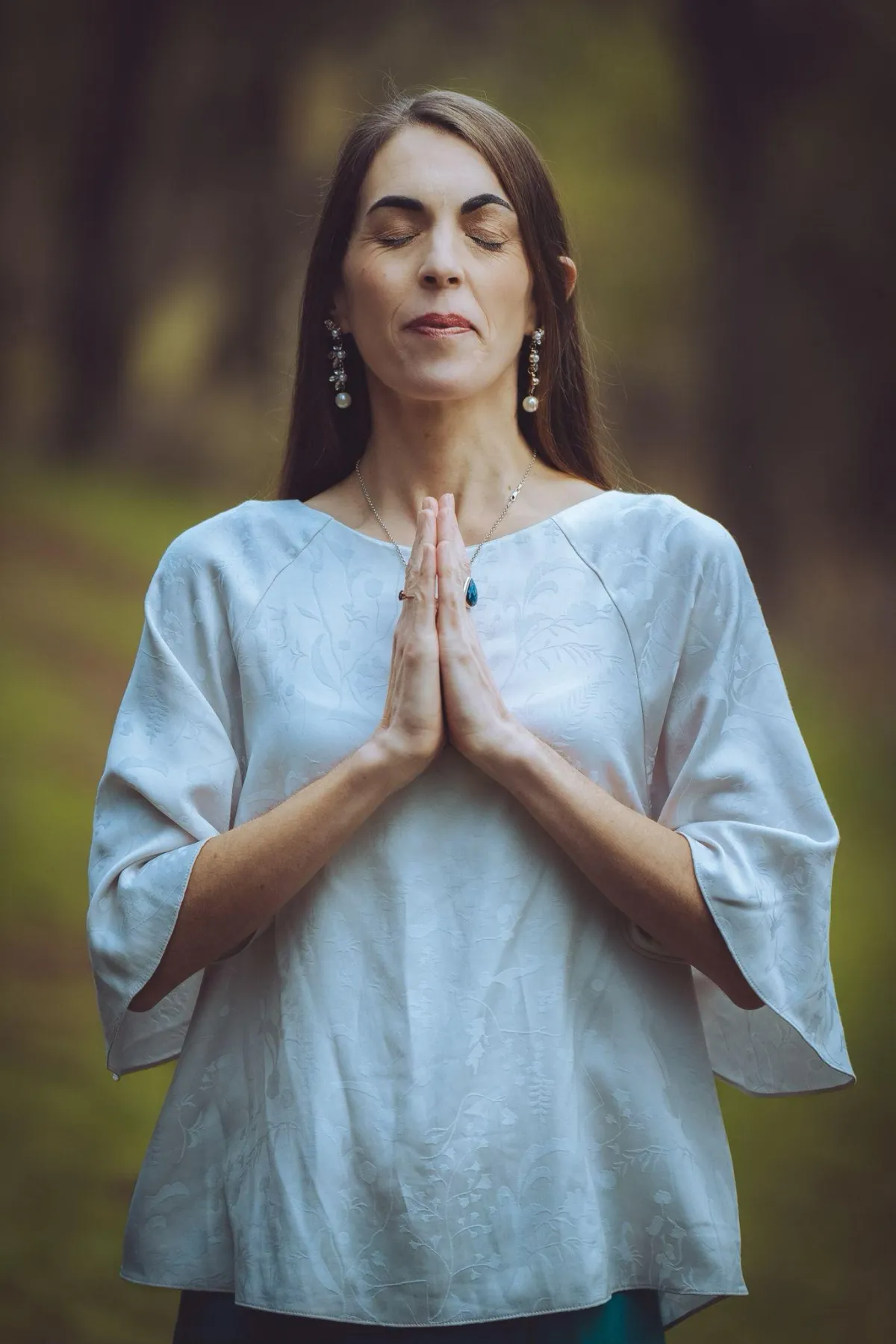 A tranquil, modern workspace with a pastel journal, a crystal, and a cup of herbal tea, bathed in soft morning light, symbolizing clarity and readiness for transformation.