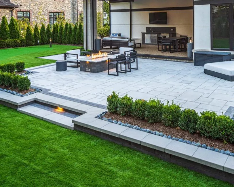 Luxury backyard hardscape with interlocking pavers in St. Charles, IL.