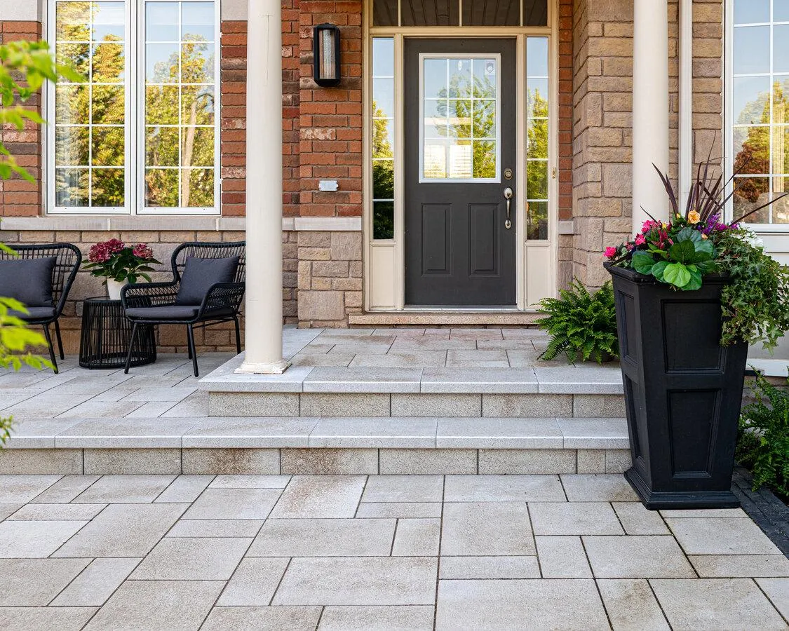 Multi-level paver patio featuring a natural stone fire pit in Geneva, Illinois.