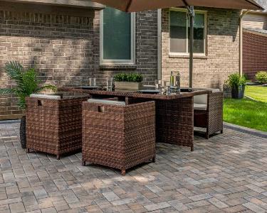 Large-scale outdoor living space with Unilock pavers in Hinsdale, IL.
