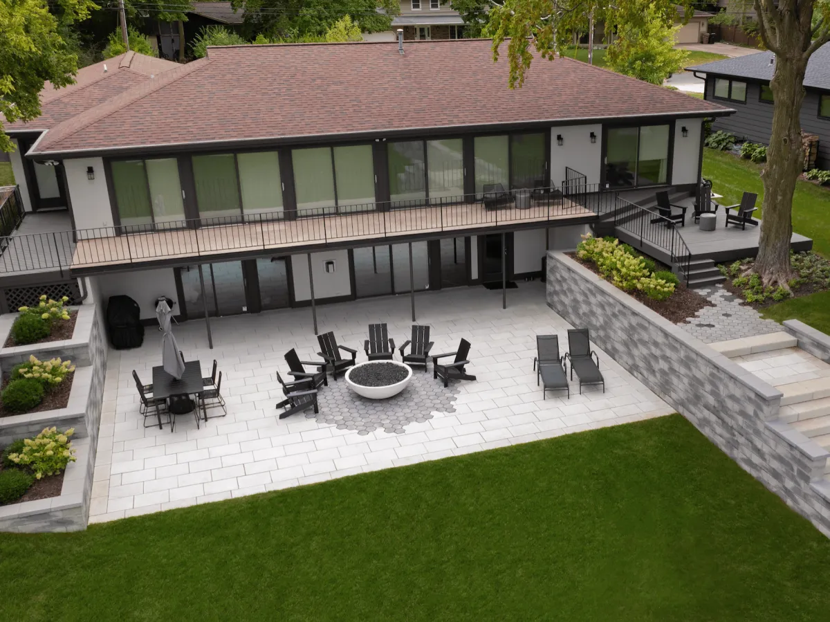 Modern paver walkway connecting a front porch to a driveway in Wheaton, IL.