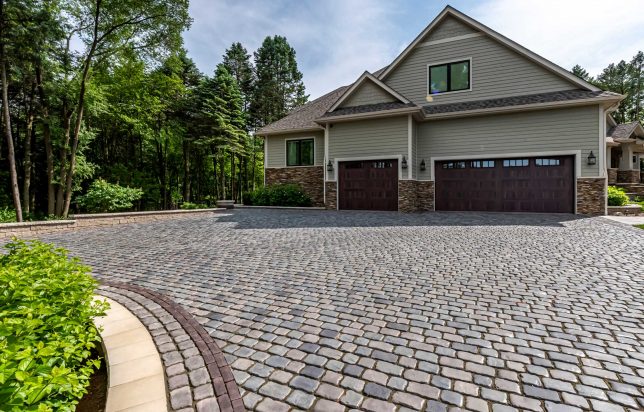 Why Your Driveway Is Cracking: Asphalt vs. Interlocking Pavers in the Chicago Freeze-Thaw Cycle