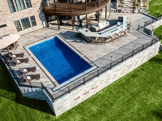 Custom outdoor fireplace and seating wall in Hinsdale, IL.