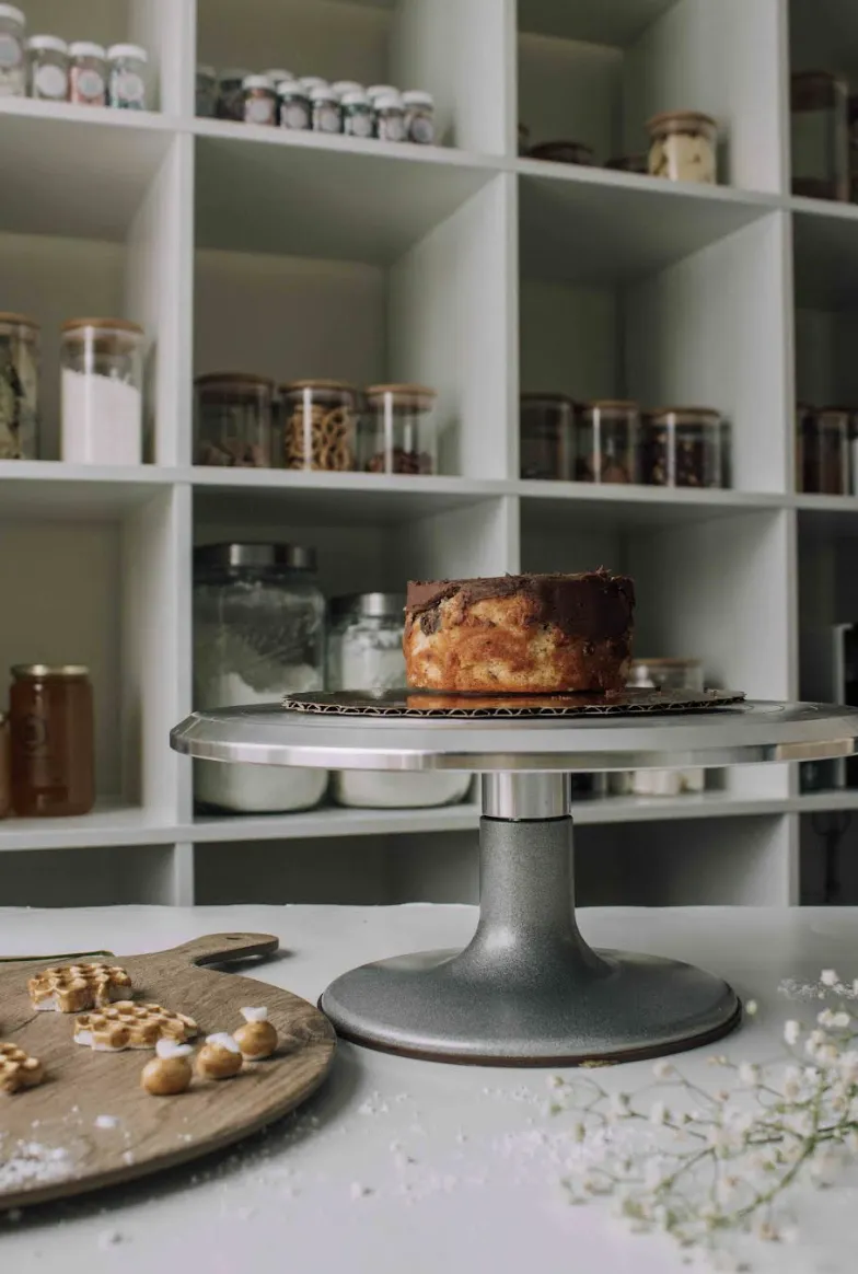 Modern organized luxury kitchen pantry with clean lines and cool shadows