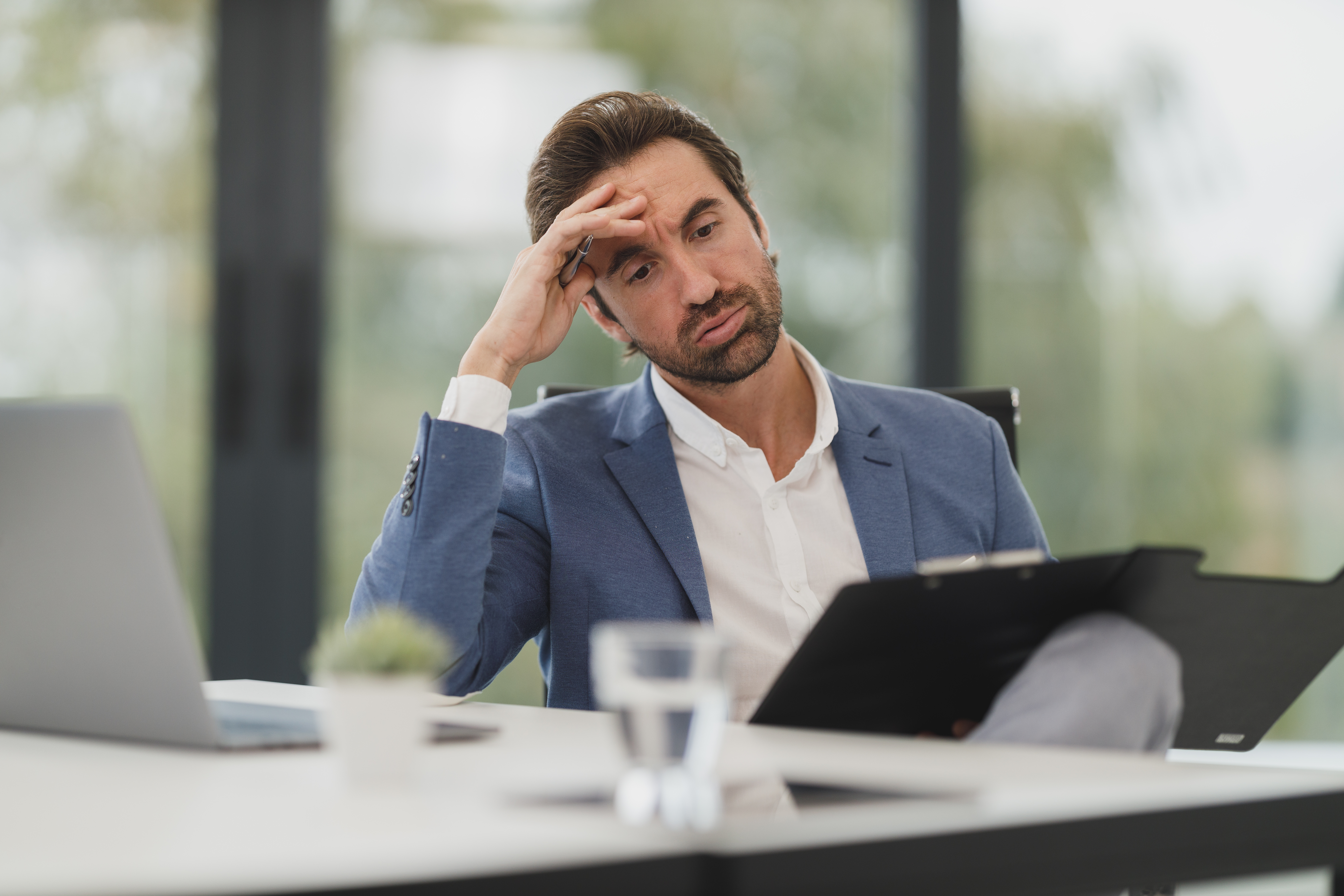 businessman looking at low revenue