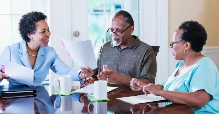 family reviewing loan documents with mortgage company