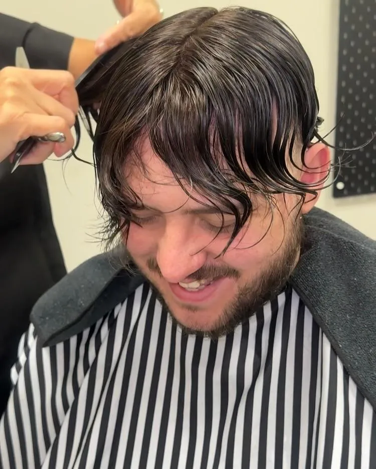 Man smiling after non-surgical men’s hair system fitting at The House of Hair GB in Birmingham – natural looking full head of hair styled by specialist barber