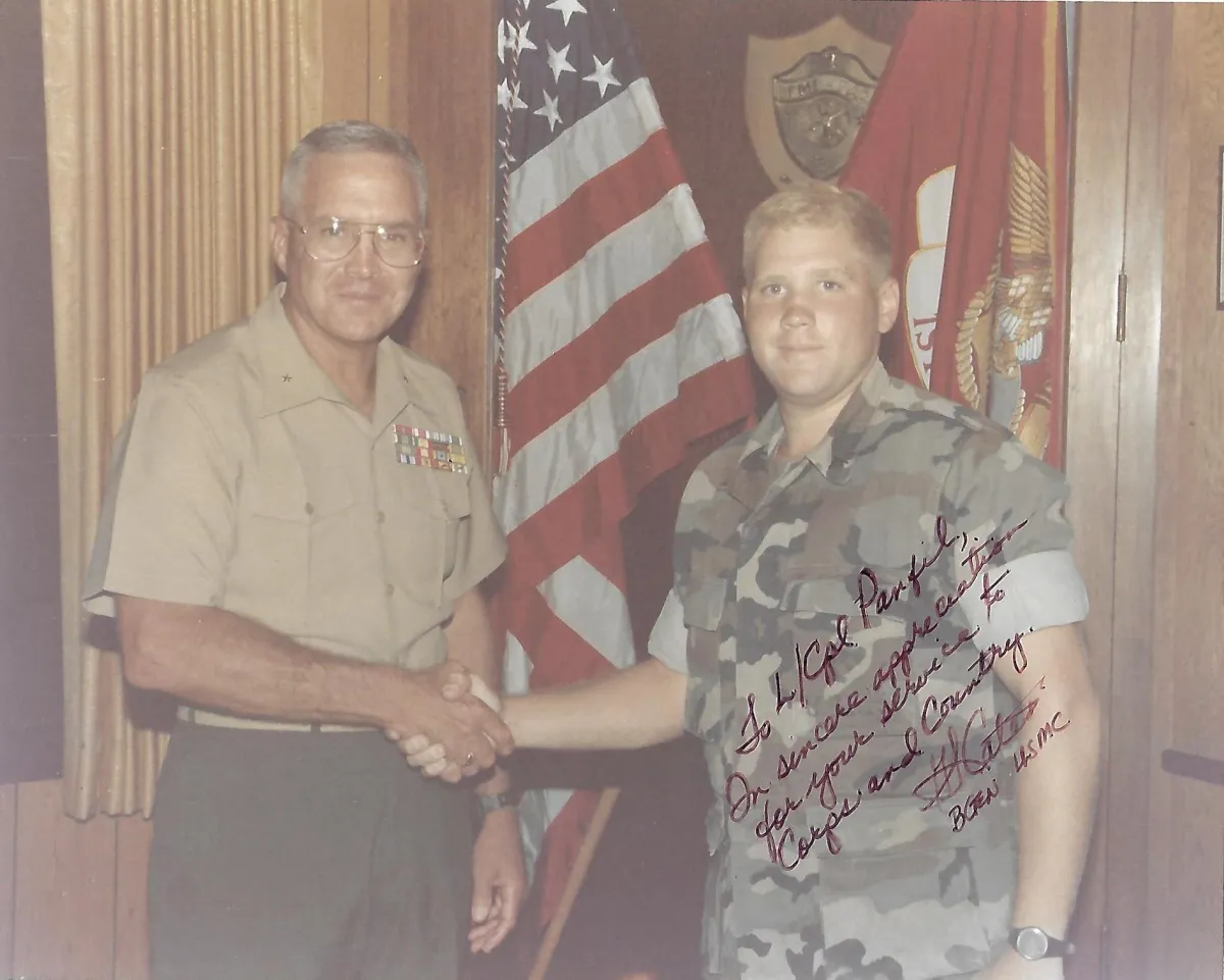 Coach Andy Panfil (right) with the Commanding Officer, MCAS Kaneohe Bay, Hawaii, in 1988. A testament to his foundational military service and the discipline that shapes Resilient Warrior Coaching.