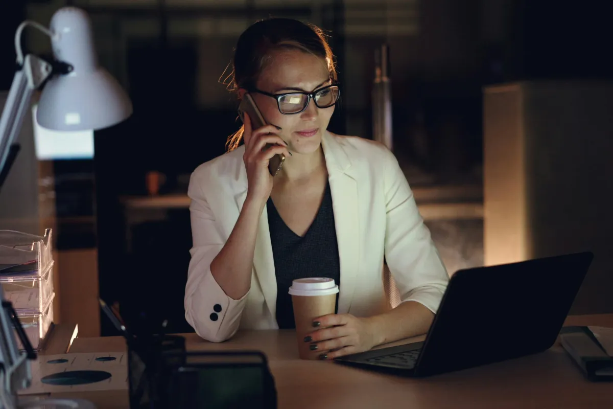 A dental practice manager standing in a warm