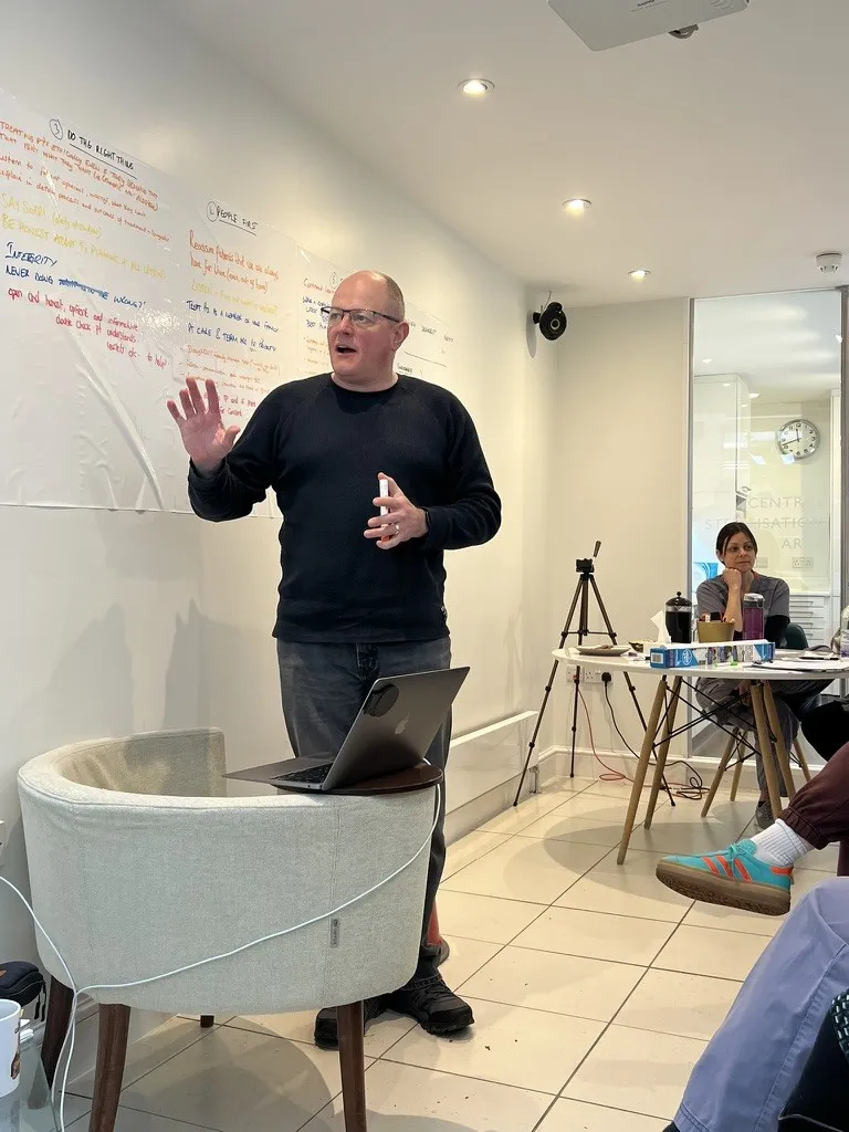 Mark Topley leading a team session in a dental practice