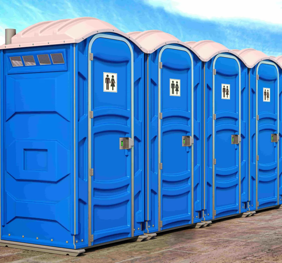 Four blue portable toilets in a row with male and female stickers on all of them