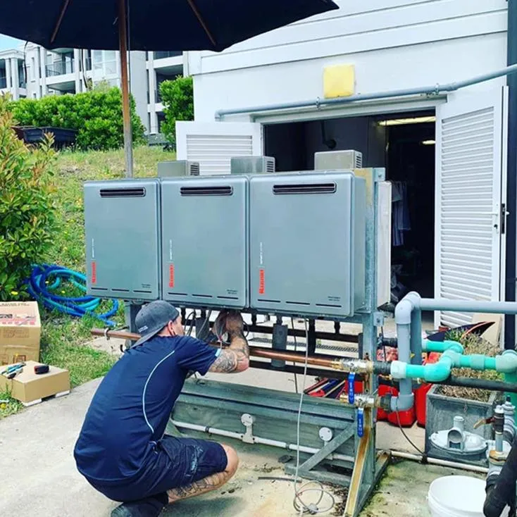Hot water cylinder servicing by local plumber in Auckland North Shore residential area