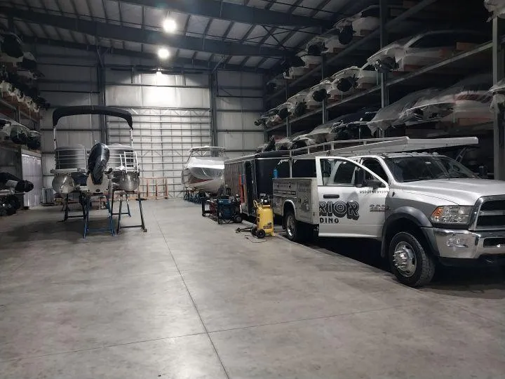 Fully equipped mobile aluminum welding trailer at off-site job location in New Hampshire woods