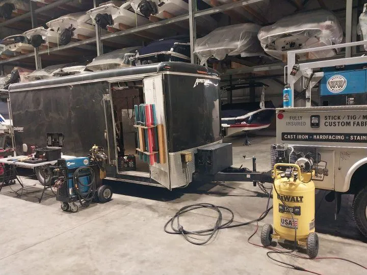 Custom aluminum welding equipment and truck at Warrior Welding indoor facility