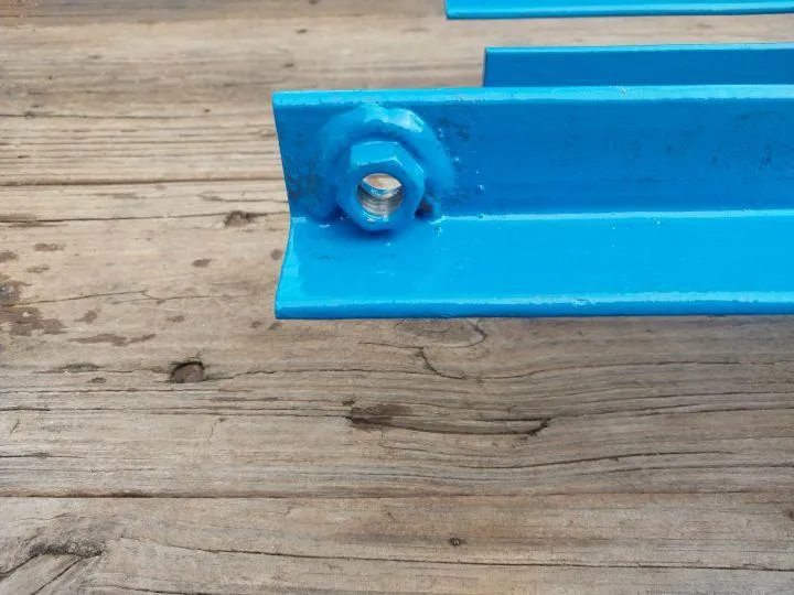 Fabricated blue-painted steel beam with welded nut by local New Hampshire welder