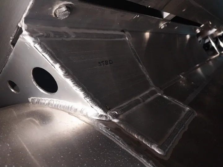 Expert aluminum weld repair on internal panel with structural reinforcement