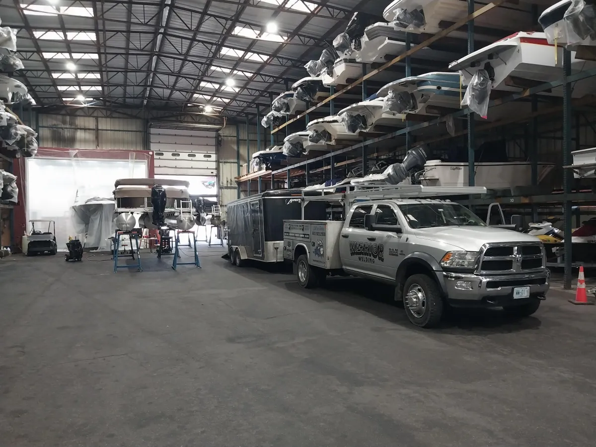Warrior Welding truck and mobile trailer setup for certified aluminum welding services at outdoor job site in Rochester, NH