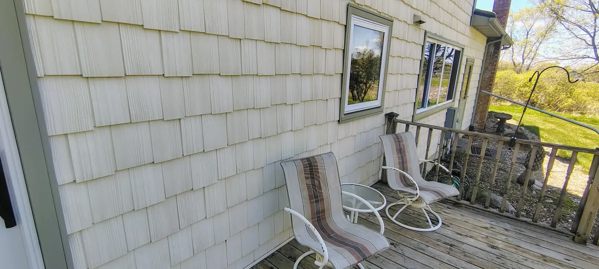 Clean, bright house siding after a soft wash pressure washing service in West Michigan.