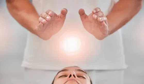 Woman Having Reiki Healing Done