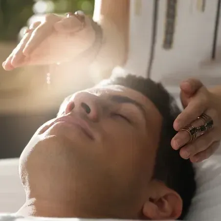 Man Having Reiki Performed on Him