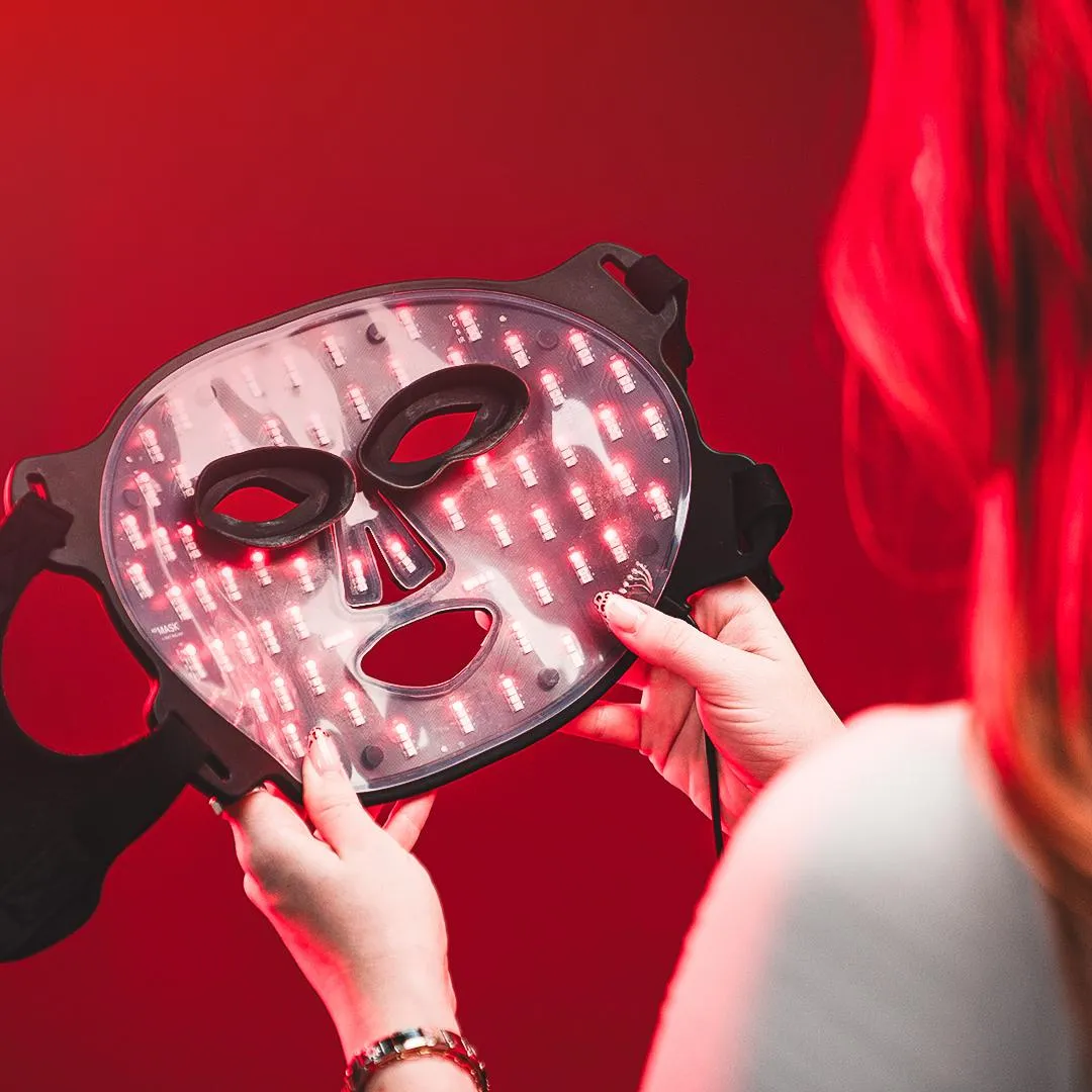 Woman putting on AO Mask