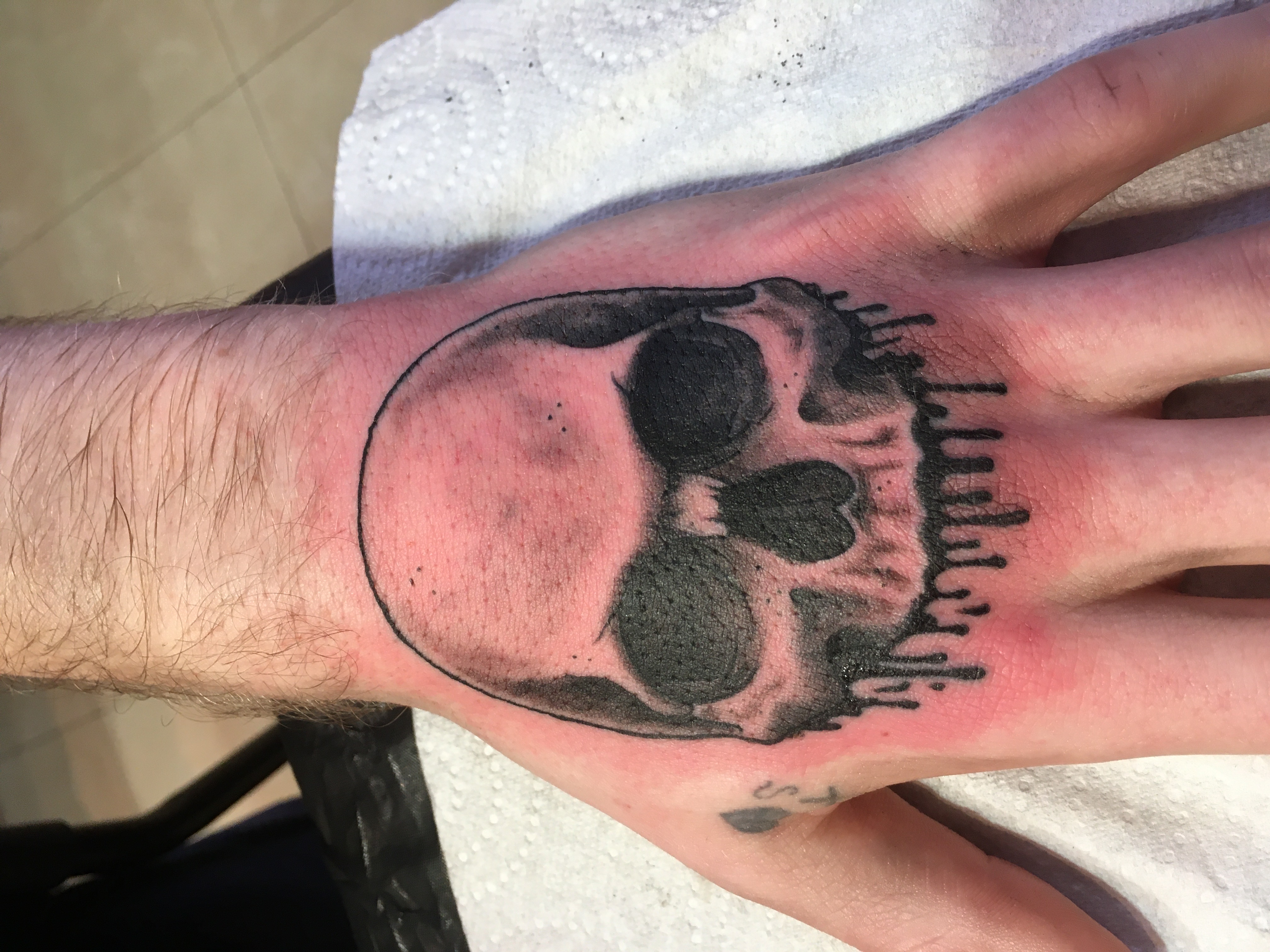 person with tattoo on right arm