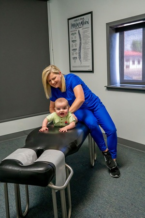 Dr Nichols adjusting pediatric infant
