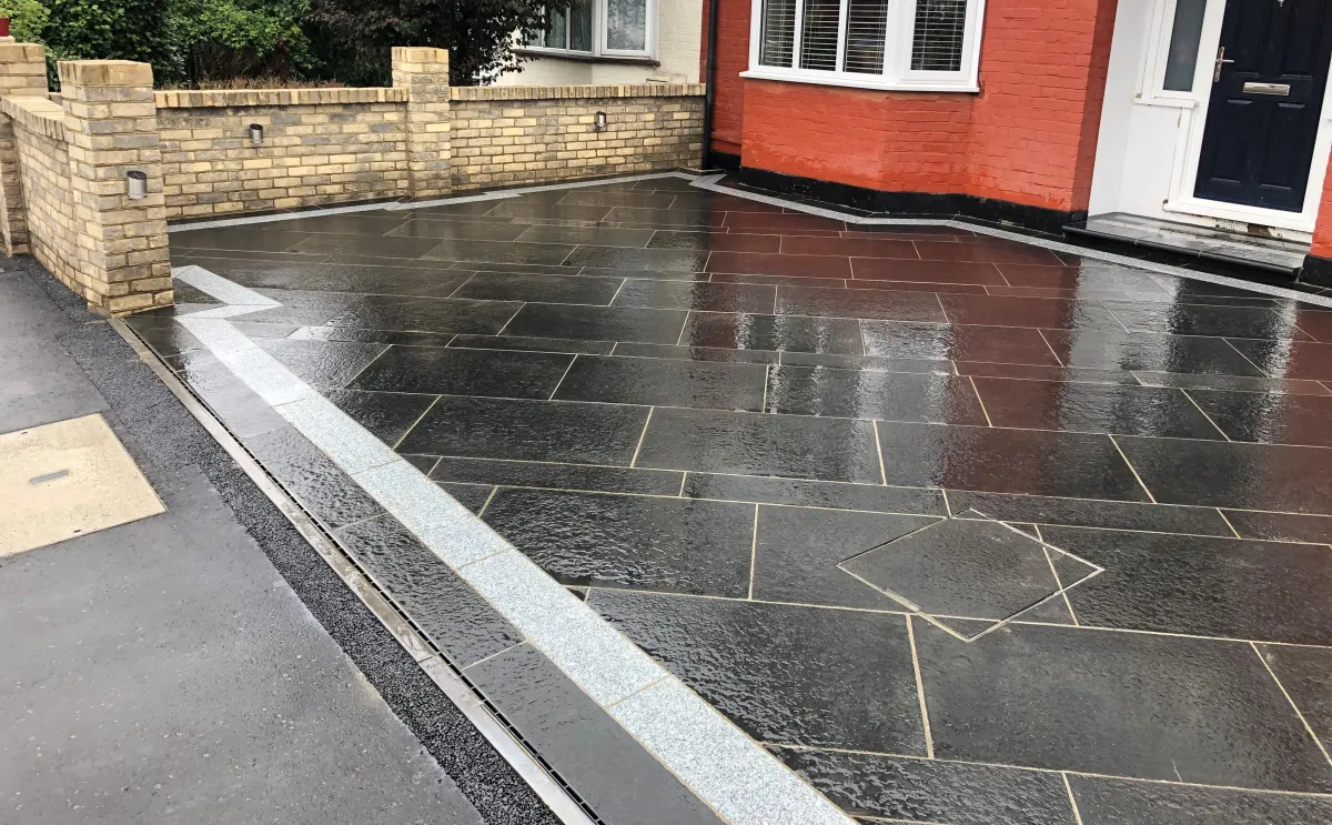 A granite driveway created with different paving patterns