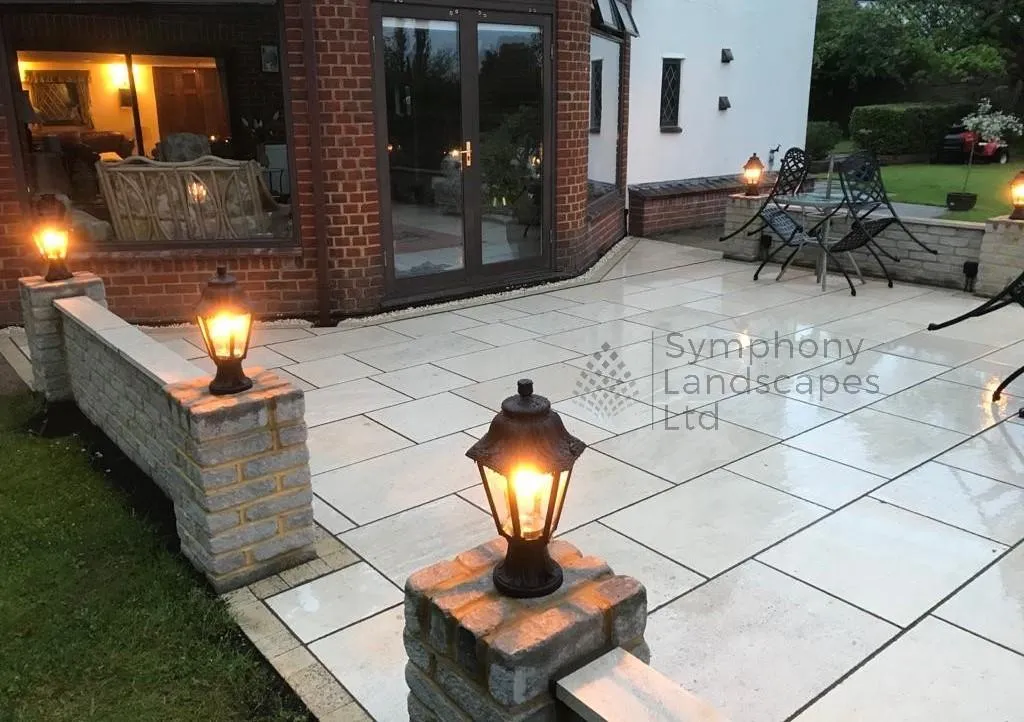 A natural smooth limestone sandstone patio created with different paving patterns