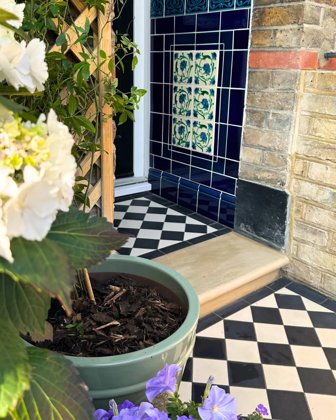 The patio is crafted from high-quality materials, creating a durable and stylish outdoor living space. Comfortable patio furniture is arranged on the smooth surface, inviting relaxation and social gatherings. Lush plants and vibrant flowers adorn the patio's edges, adding a touch of natural beauty and tranquility to the overall ambiance.