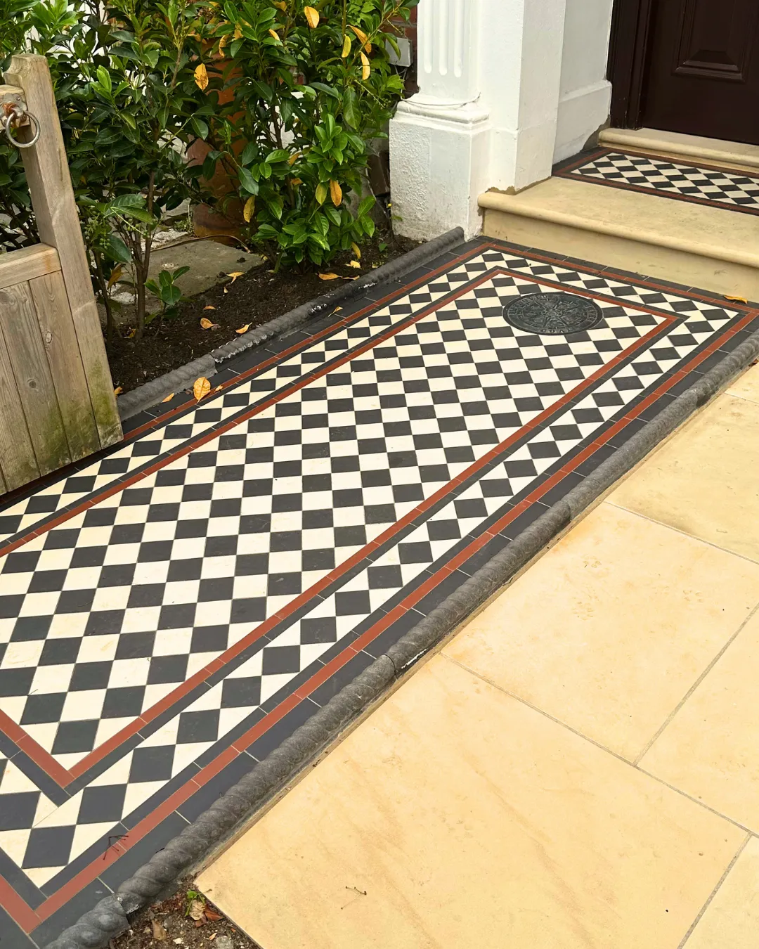 The patio is crafted from high-quality materials, creating a durable and stylish outdoor living space. Comfortable patio furniture is arranged on the smooth surface, inviting relaxation and social gatherings. Lush plants and vibrant flowers adorn the patio's edges, adding a touch of natural beauty and tranquility to the overall ambiance.