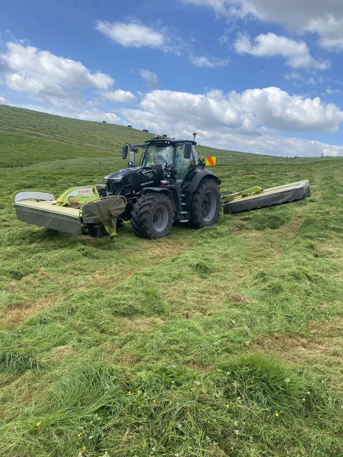 Deutz-Fahr tractor undersowing and regrassing paddock in Waikato farmland