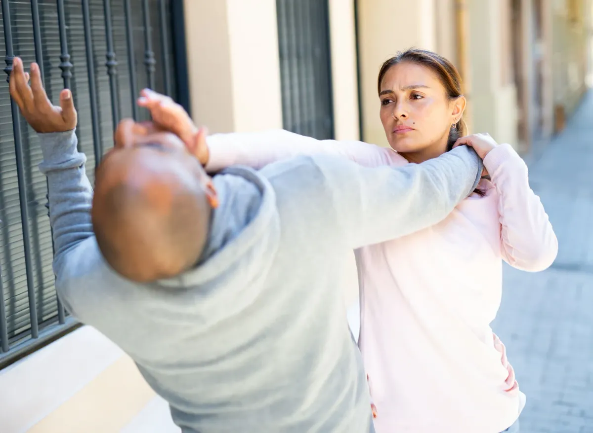 A woman practising self-defence at Krav Maga Center