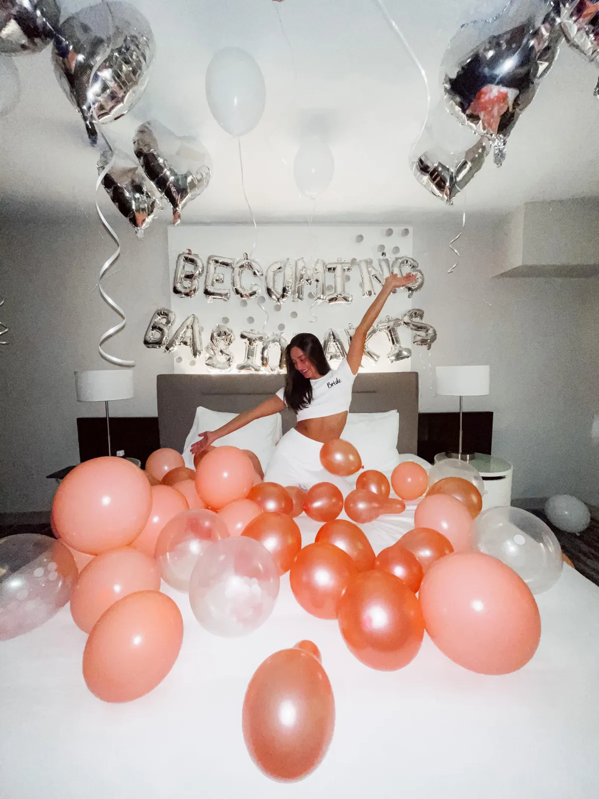 girl on bed with balloons