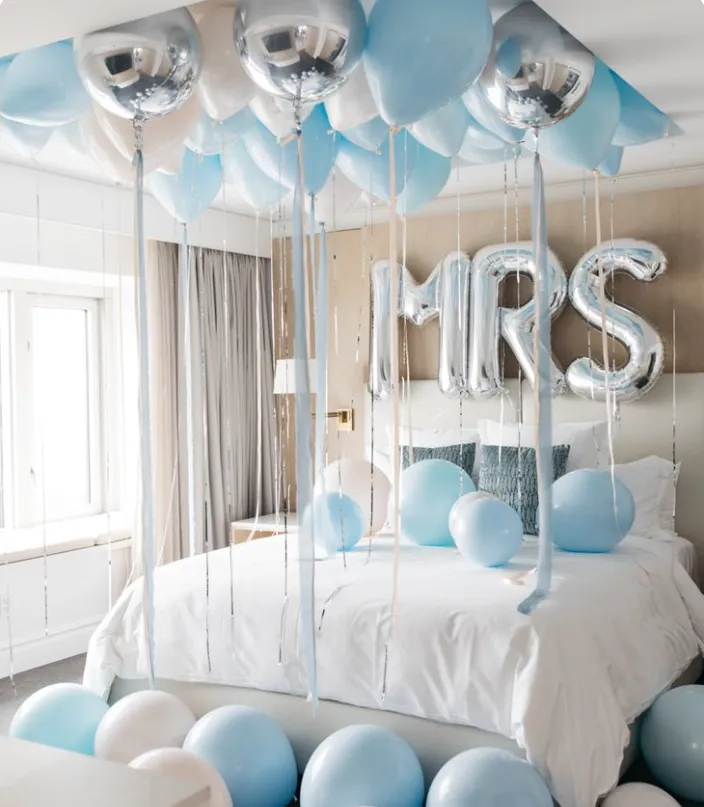 blue and silver balloons in hotel suite