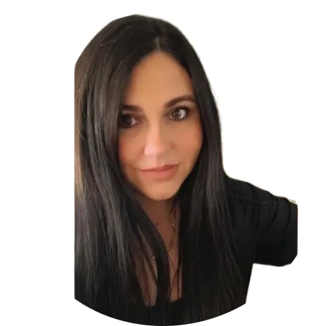 A portrait of a woman with long, layered black hair and bangs, smiling softly.