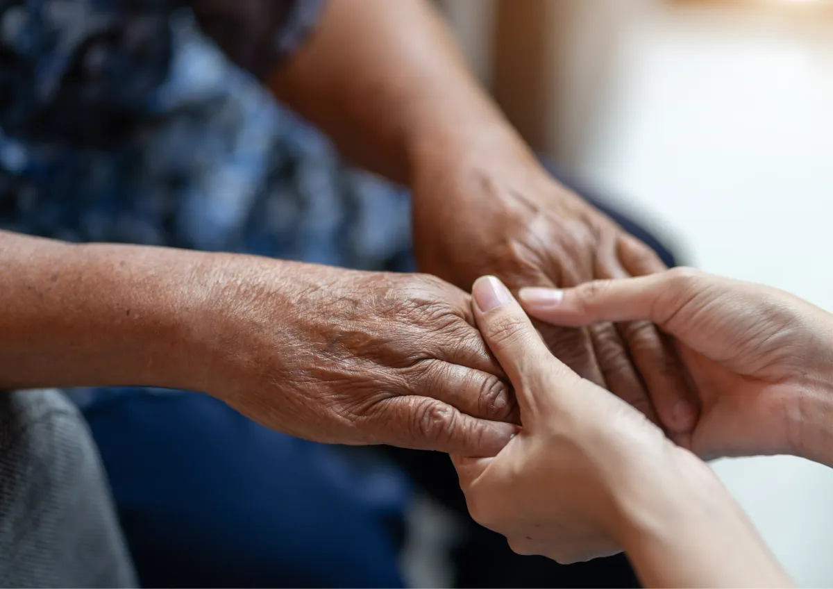 Holding hands for support, compassionate care for the bereaved