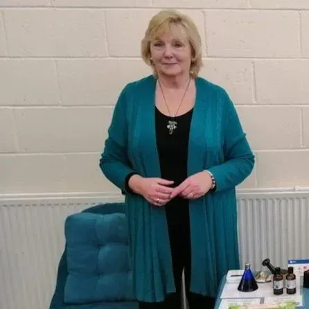 Image of Carol Bantick - Ayurvedic Practitioner and Soul Midwife standing next to her stand at a recent With The End In Mind Event 