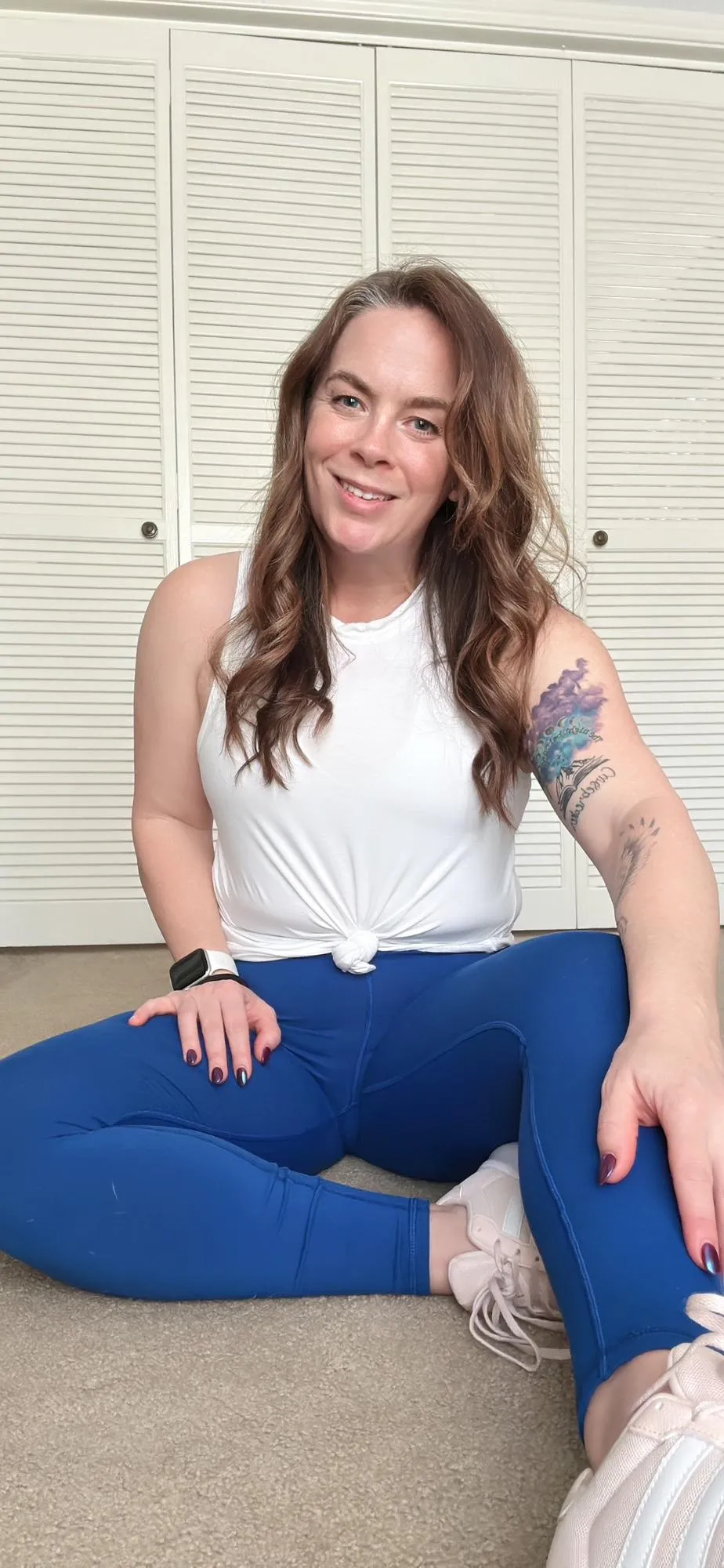 Lauri Mazeikas coaching a postpartum client through a personalized workout
