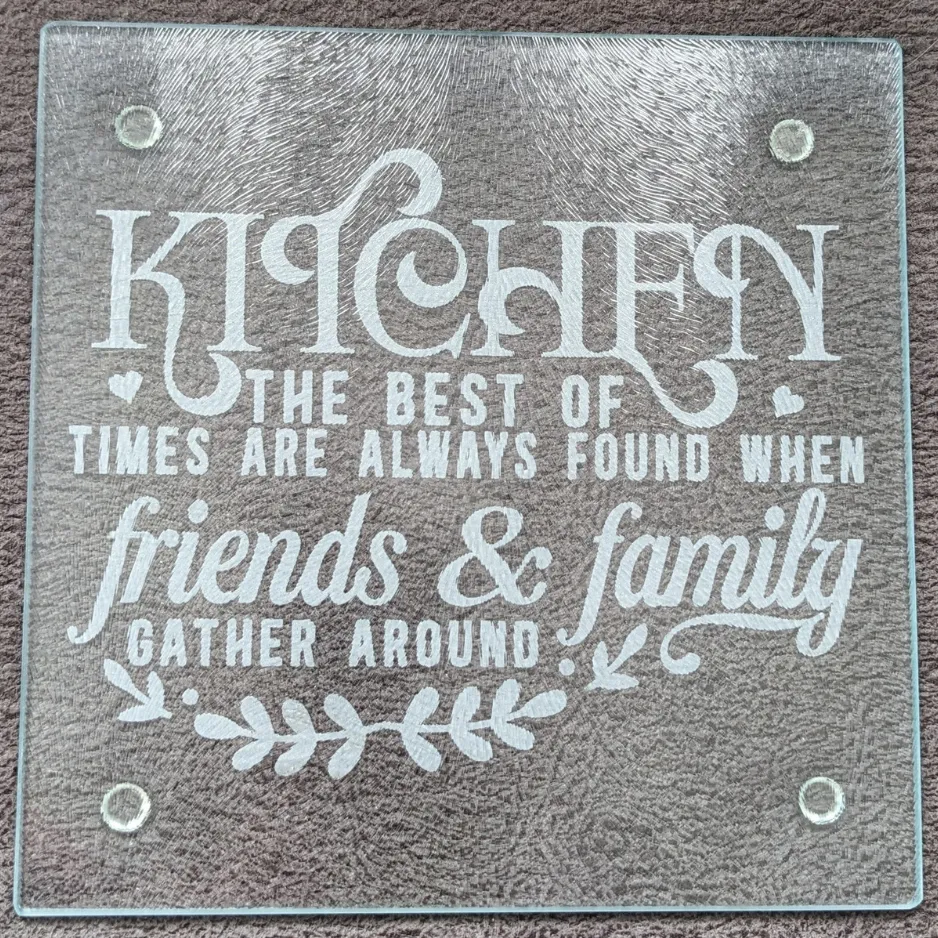 Custom etched glass cutting board reading Kitchen - The best of times are always found when friends & family gather around