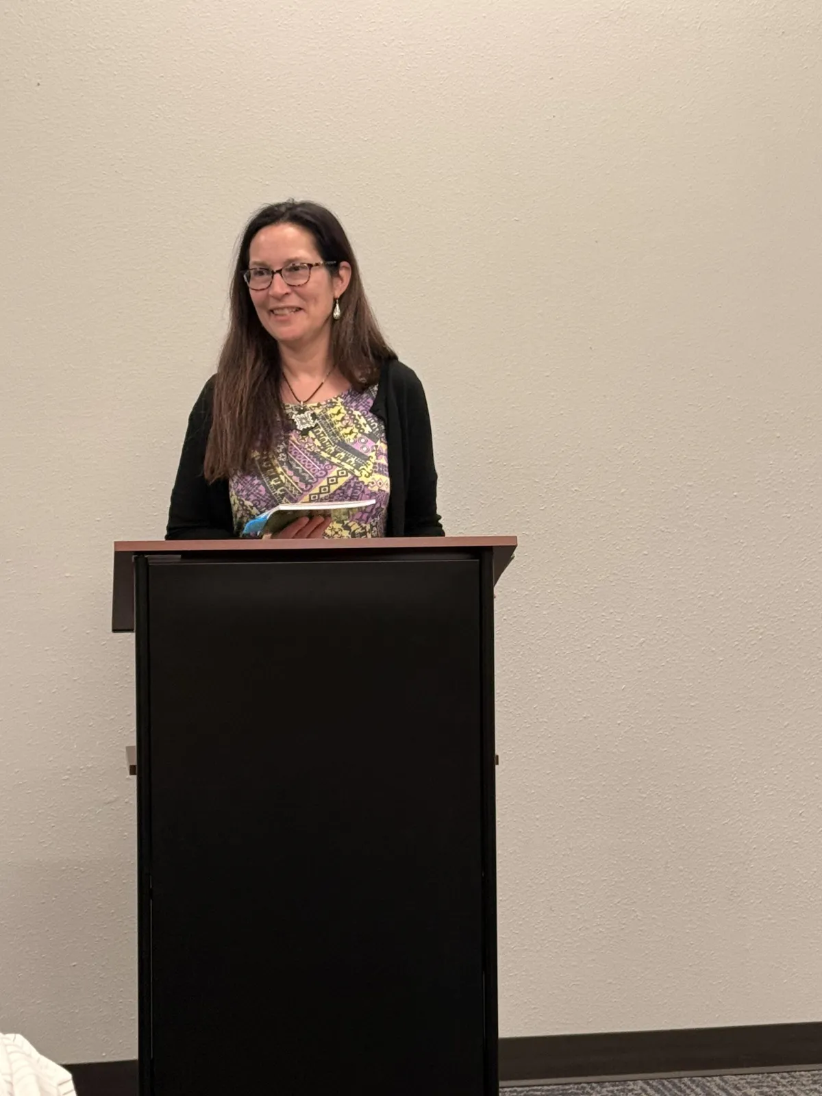 picture of Dr. Gulley reading her poetry at the Cass County Norther Resource Center Library