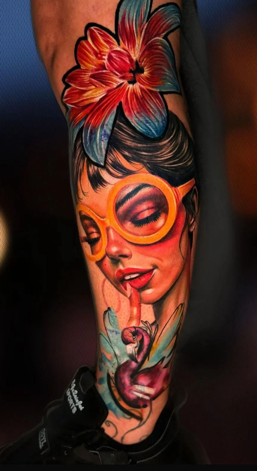 person in blue denim shorts and white nike sneakers standing on gray concrete floor