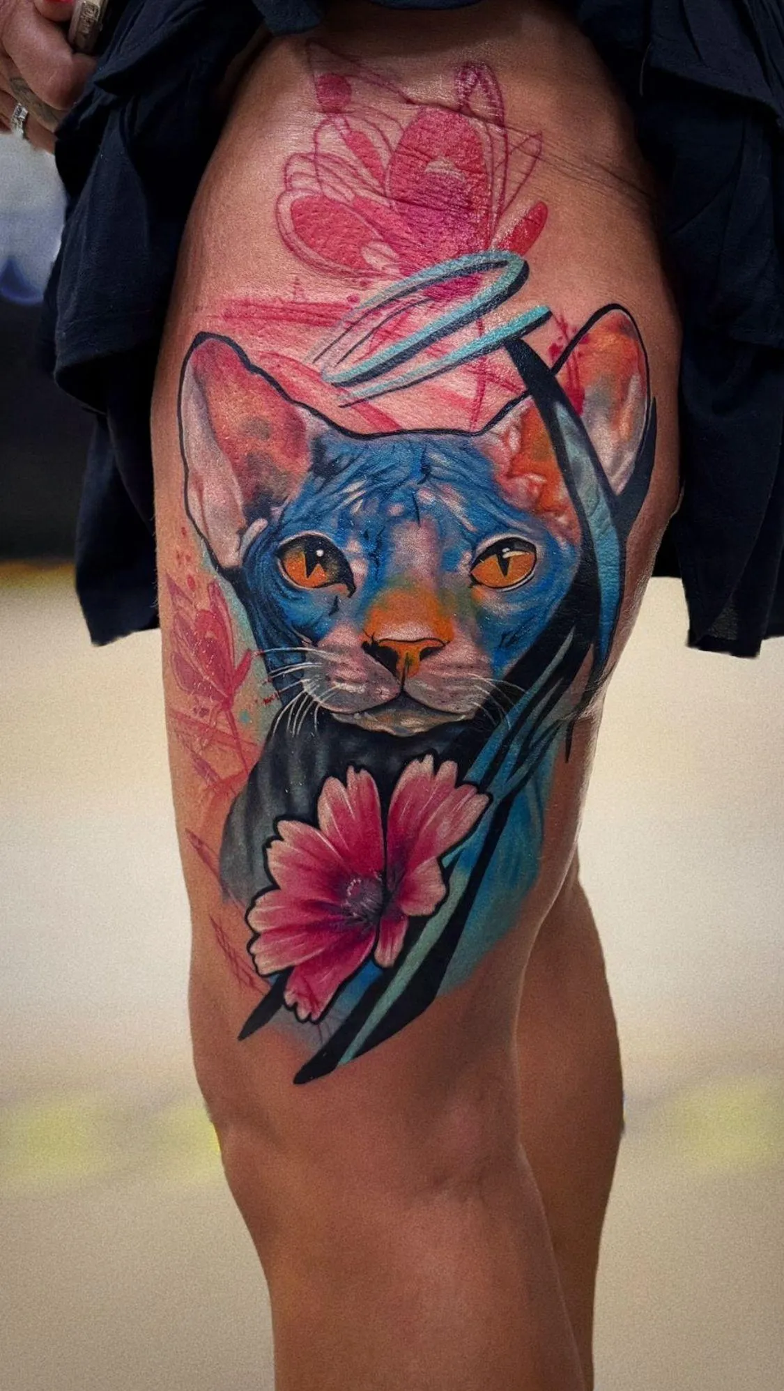 person with tattoo on right arm