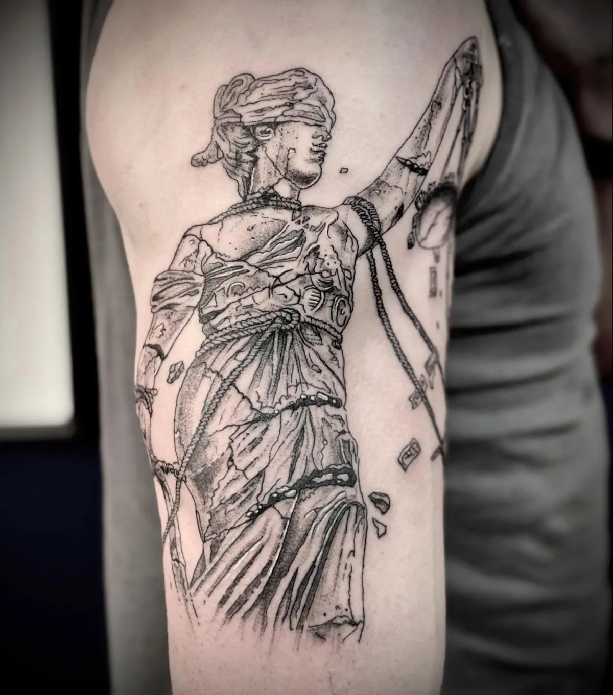 person with tattoo on right arm