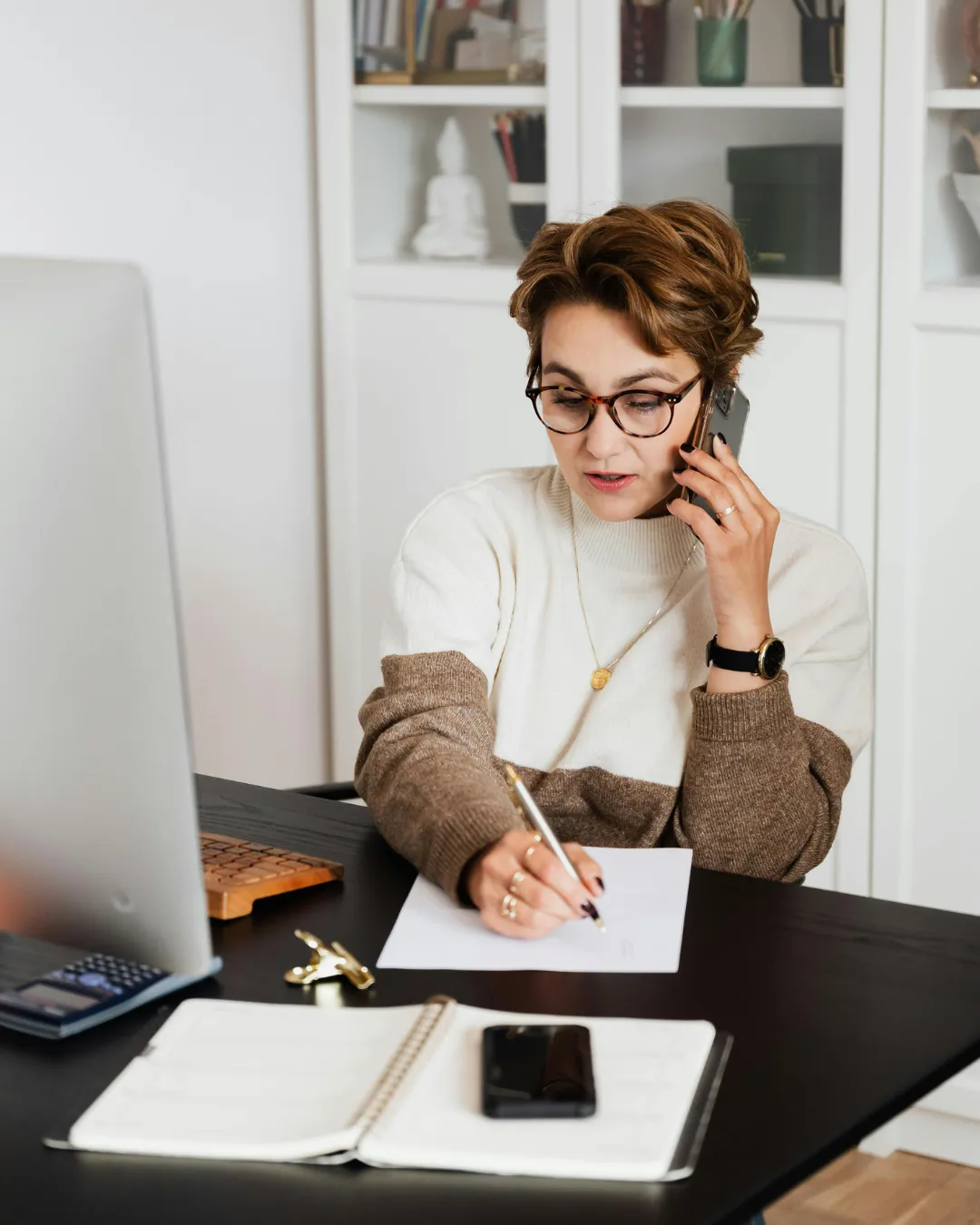 Professional making phone call for aggressive insurance claim follow-up