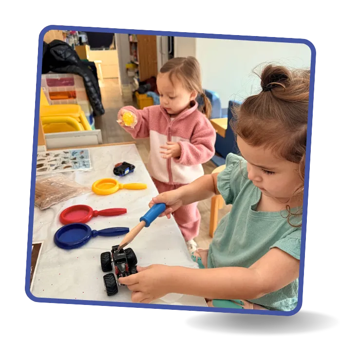 Preschool children developing fine motor skills through hands-on play at Beginnings Learning Center