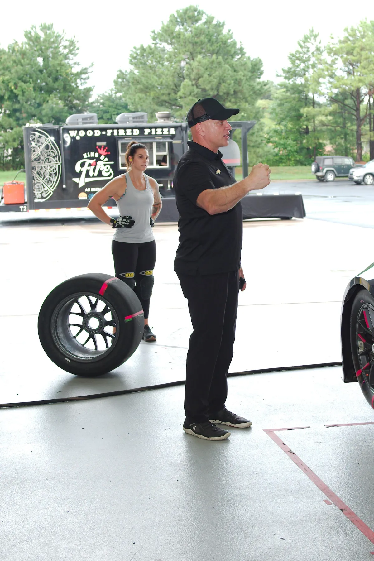 Shaun Peet demonstrating pit-crew techniques during a training session.
