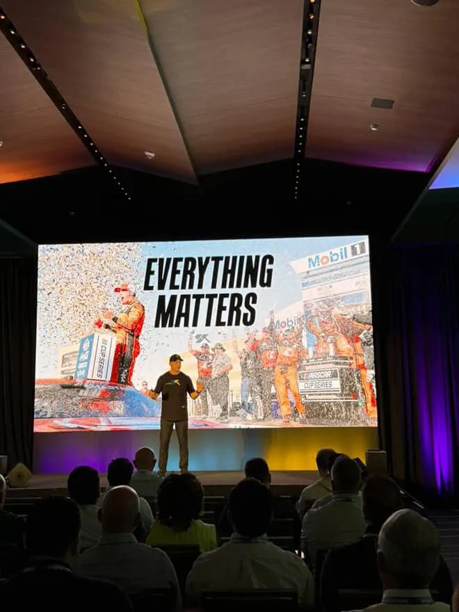 Shaun Peet demonstrating pit-crew techniques during a training session.