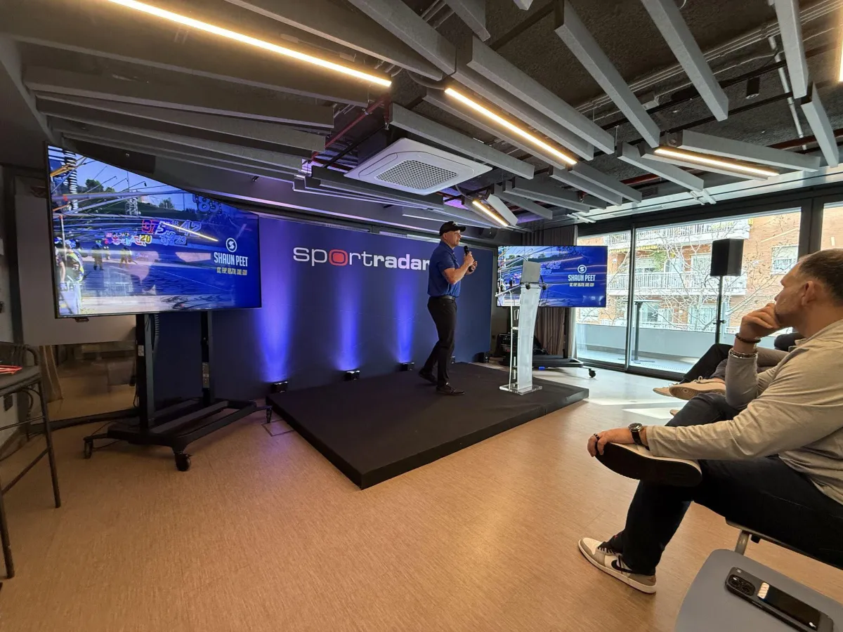 Shaun Peet delivering a keynote presentation for SportRadar in Barcelona, speaking on leadership, performance, and data-driven decision making to a live corporate audience.