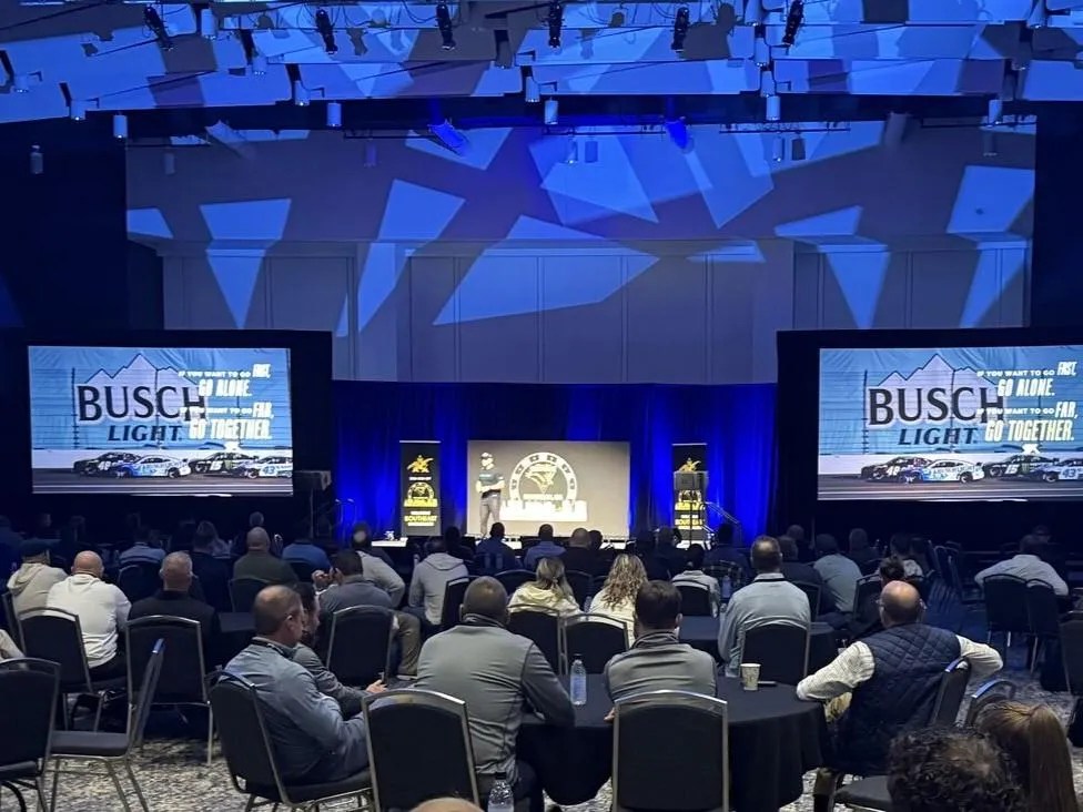 Shaun Peet addressing business leaders at a Busch Light national conference, delivering a keynote focused on leadership, culture, and sustained high performance.